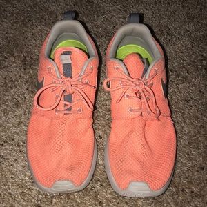 Neon orange Nike Roshe sneakers